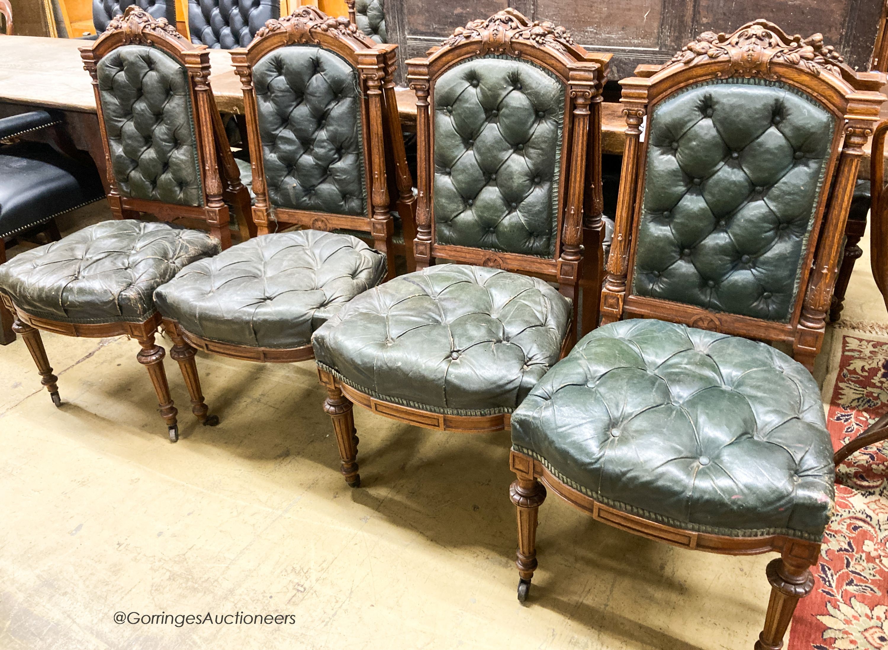 A set of twelve Victorian carved oak buttoned back and seat dining chairs, width 52cm, depth 50cm, height 106cm